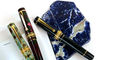 alpha eyedropper fountain pens closeup up on caps